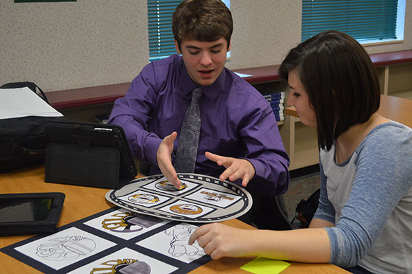 Seniors Riley Poynter and  Maggie Walsh work on choosing a logo for the Gold Mine. The Gold Mine staff have been working with Mr. Helming’s class to design logos.
