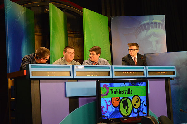 Senior Brian Schnoor and his fellow Quiz Bowl competitors work together for an answer on the Brain Game. Schnoor said, "you should just say something because you might get the point." 