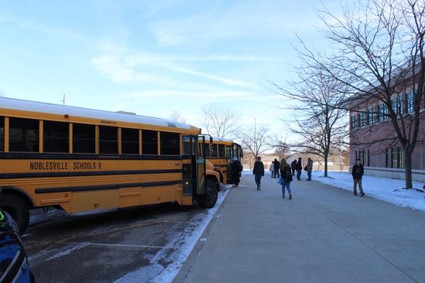 NHS students board the buses on a cold January afternoon. To keep students from having to bear the elements, Superintendent Beth Niedermeyer may choose to use eLearning instead of in class time in the case of extreme weather.