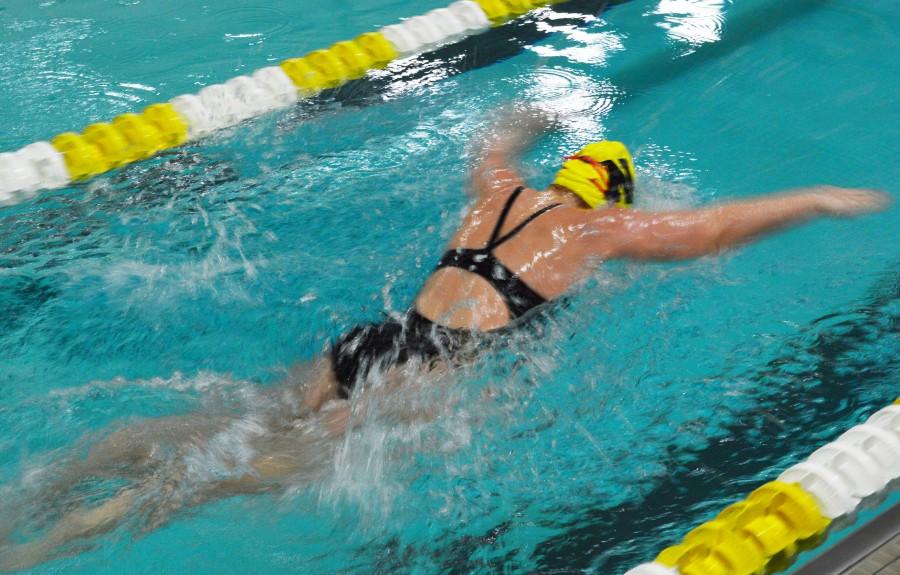 Senior Emily Christopherson places first in butterfly. She ended the night on a strong note finishing high in all her events.