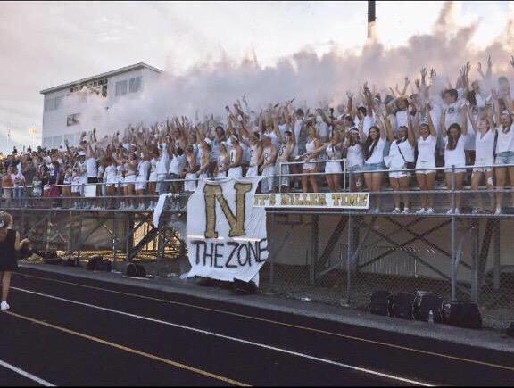 Miller students throw up white powder to kickoff the 2015 season. They defeated Lawrence North in their home opener.