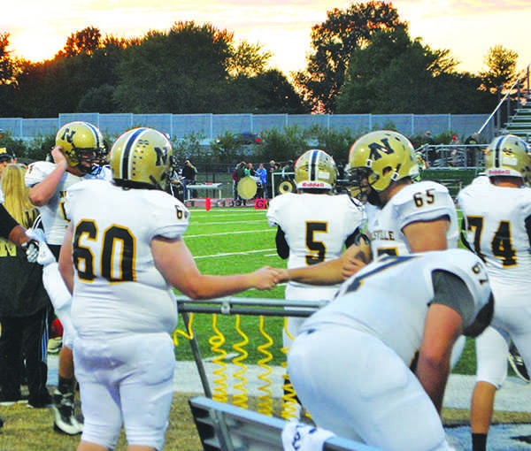 Noblesville football player, Duncan Stephenson (60) celebrates with teammate, Dalton Davis (65) after a successful play. The Millers have their next game against Hamilton Southeastern on Oct. 2. 