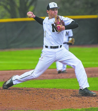 Freshman Reese Sharp throws a pitch from the mound to an awaiting batter in the box. Sharp pitched his first varsity win on April 15, 2016. 