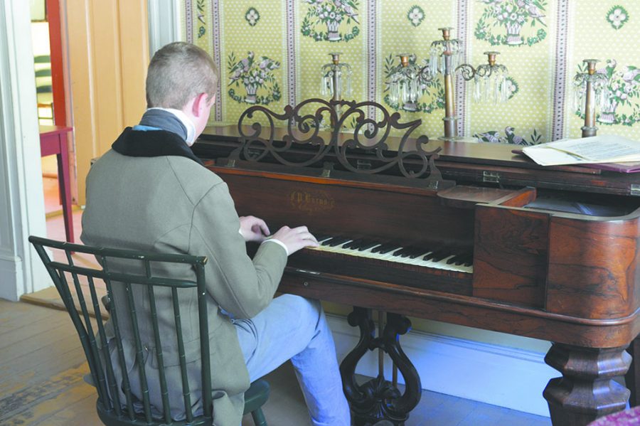 Trevor Zavac plays piano at Conner Prairie. He has volunteered at Conner Prairie for six years. 