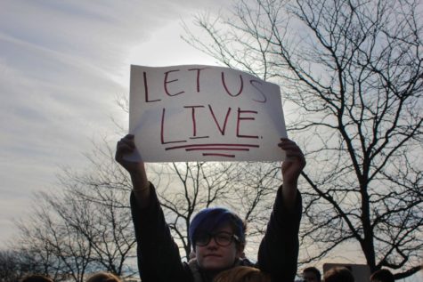 A student holds up a sign during the walkout.