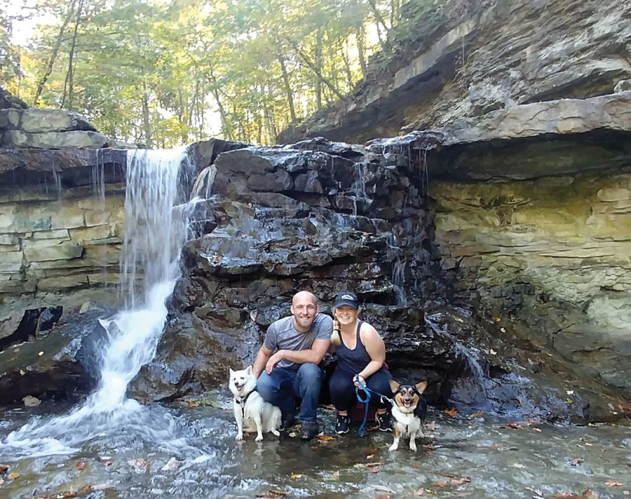 O’Neal camping with her two dogs and her husband. O’Neal went hiking with her husband and her two dogs and found a waterfall.