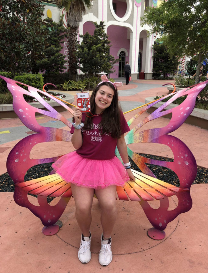 Claussen sitting on a butterfly bench at Give Kids the World. She visited GKTW for the second time this past spring break. 