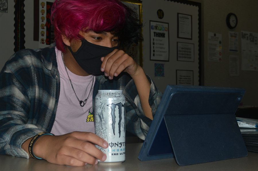 Sophomore Todd Koehler has his daily Monster Energy before class. Many students drink Monster in preparation for their classes.