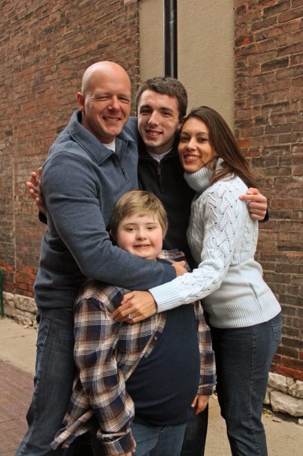 Tyler Ashby poses with father, mother, and younger brother for a family portrait. Click on the link below to sign his petition to fight for this cause.