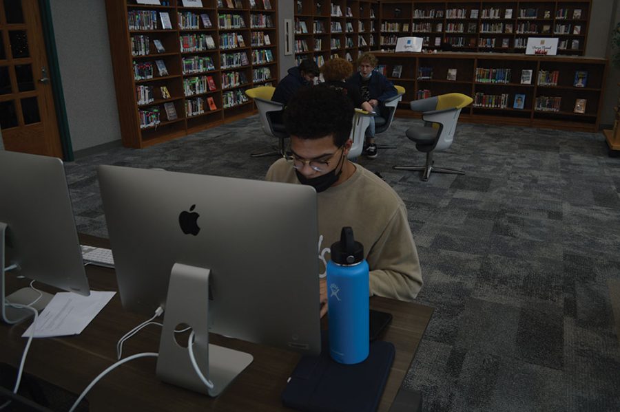 Sophomore Carter Richardson works on the computers in the media center. All students are welcome to use the media center's technology.