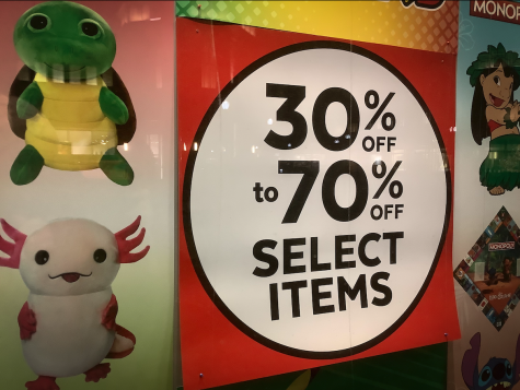 Consumerism reaches an unwelcome high during the holiday season. Posters advertising discounts attract large amounts of shoppers, and companies make huge profits.