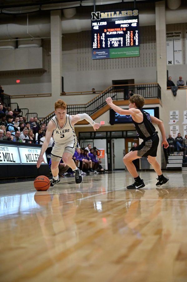 Junior Aaron Fine dribbles past a defender. The Millers fell to Brownsburg with a final score of 60-54. 