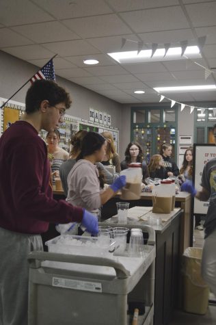 Members of the Asian Student Union prepare iced coffee for their customers at the Coffee Mill. The club is led by juniors Abdallah al Samaraee, Kate Goins, and Julie Nguyen.