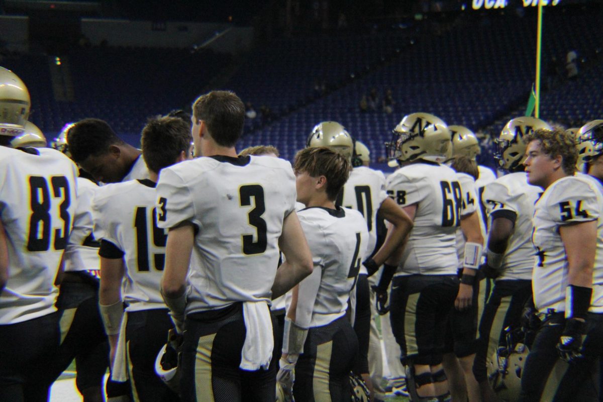 Senior running back Logan Shoffner looks on at the Lucas Oil Stadium field. Shoffner led the team that night with 20 rushes for 181 yards.