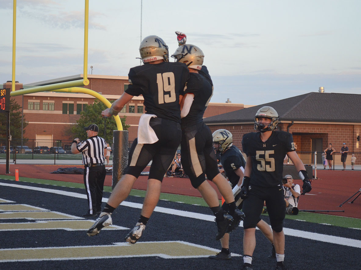 Seniors Jacob Baker and Logan Shoffner, quarterback and running back, respectively, celebrate a touchdown.