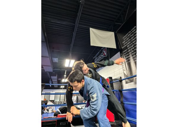 Flores gets ready to throw his opponent over his shoulder while sparring. He trains 7 days a week and works hard to perfect his skills.