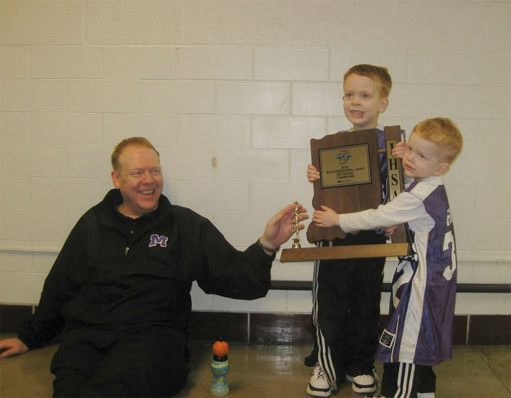 Aaron and Adam Fine celebrated Matts sectional victory. Their father began coaching at NHS five years ago.