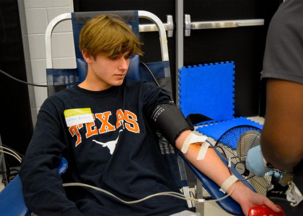 Junior William Biondich waits for his blood donation to finish. 