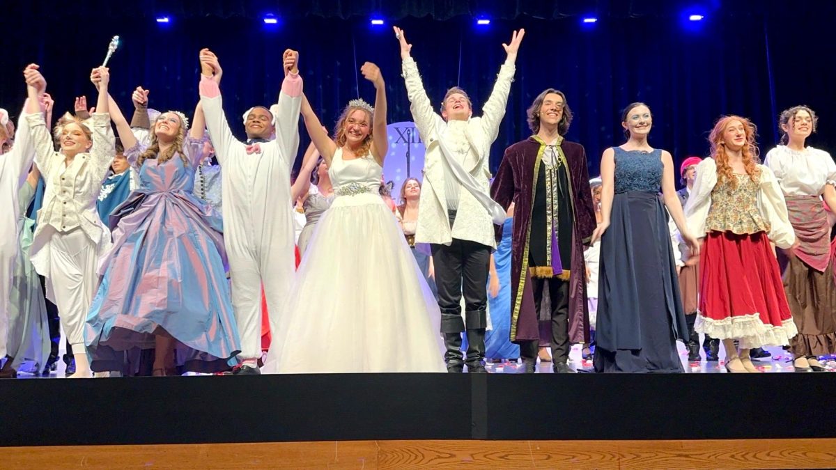Following their final performance of Cinderella, several NHS seniors take their final bows before pursuing postsecondary performing arts. Photo provided by Addie McMillan.