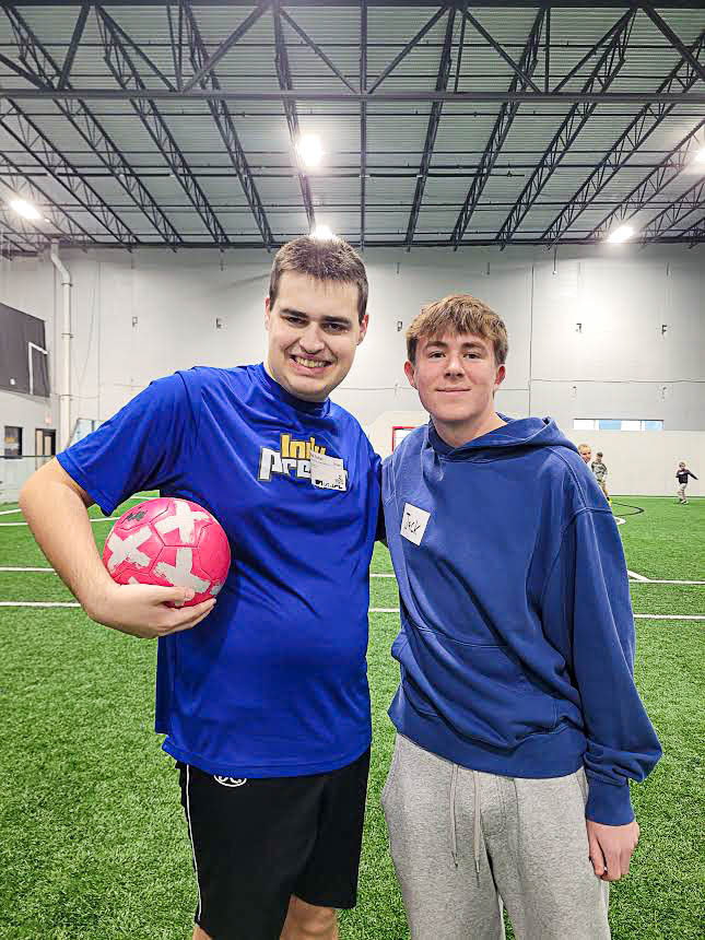 Nick Scholl and his volunteer partner, Jack Murphy, spend free time together each practice. This time helps the volunteers and players become better friends.